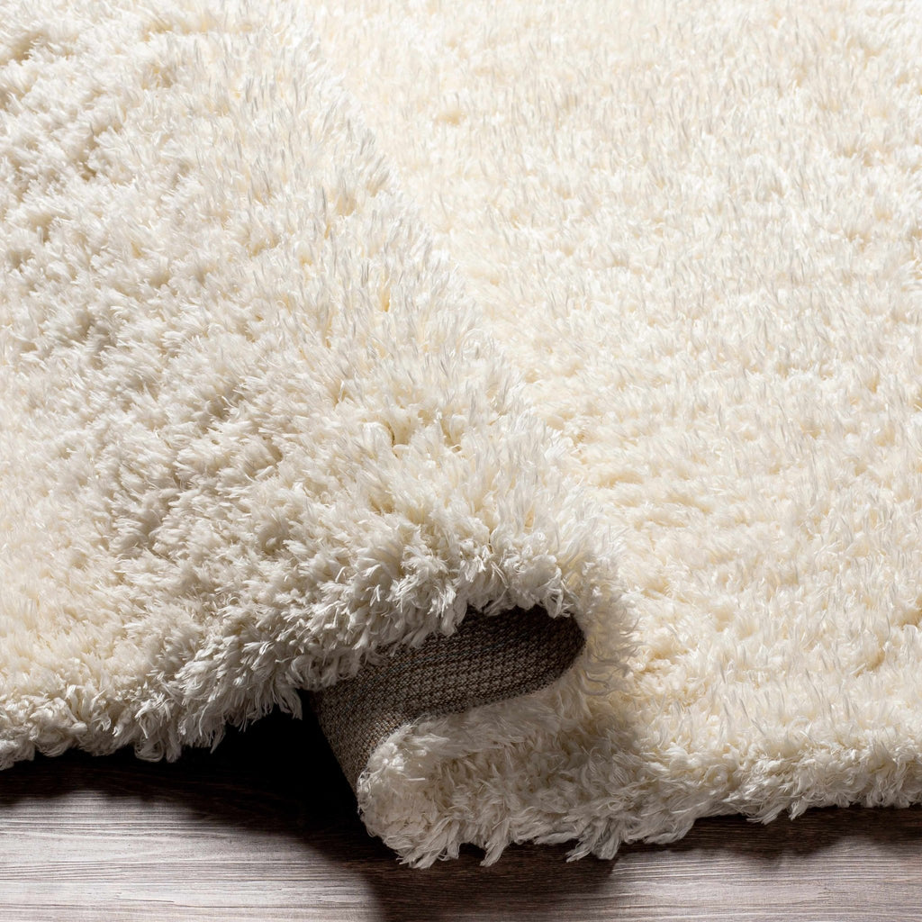 Siari Solid Cream Plush Rug - thewrightstore